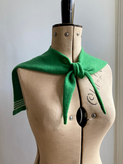 Bright green sailor collar scarf with white stripes shown on a mannequin.